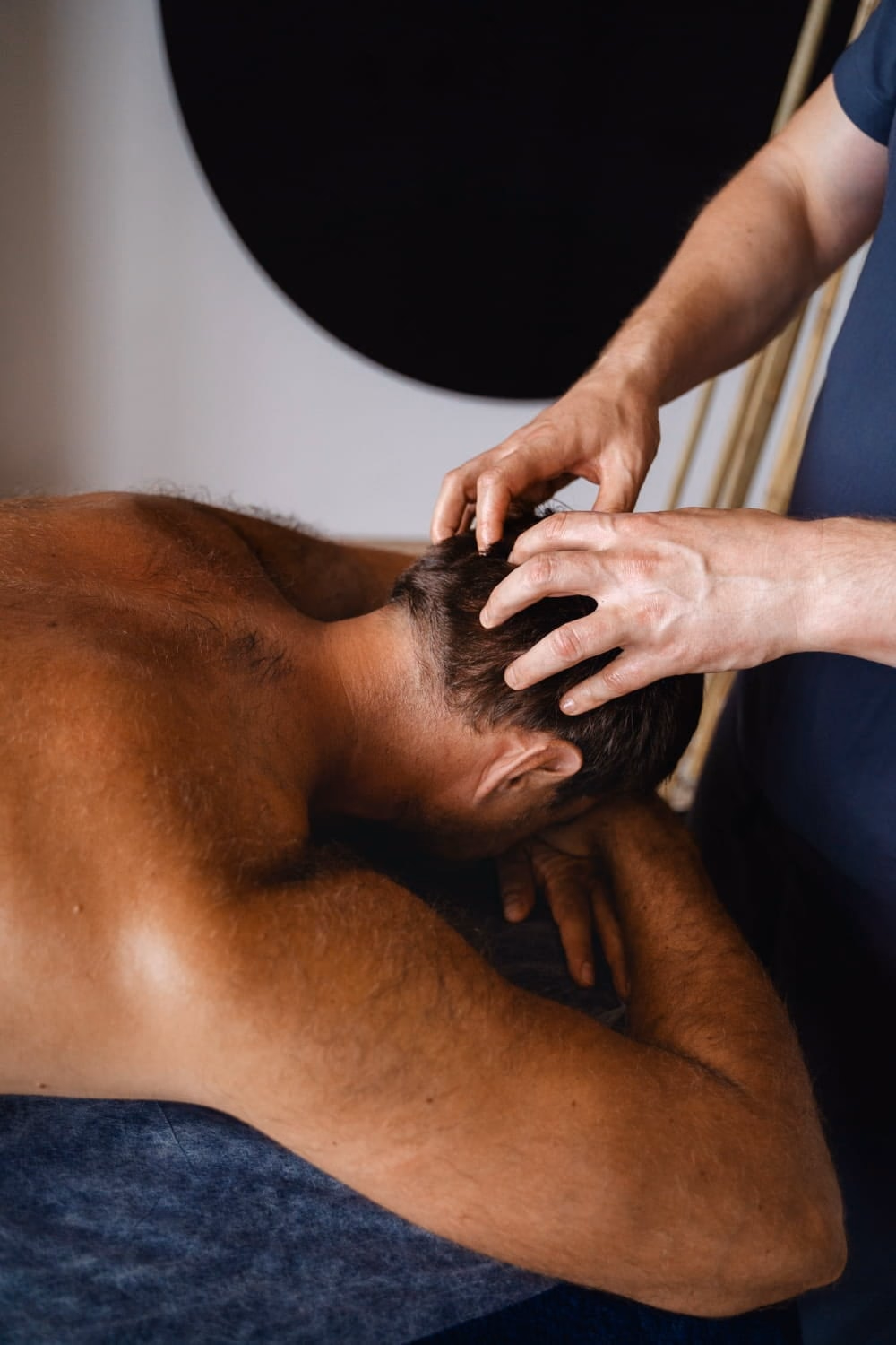 Myotherapist applying manual therapy to a client